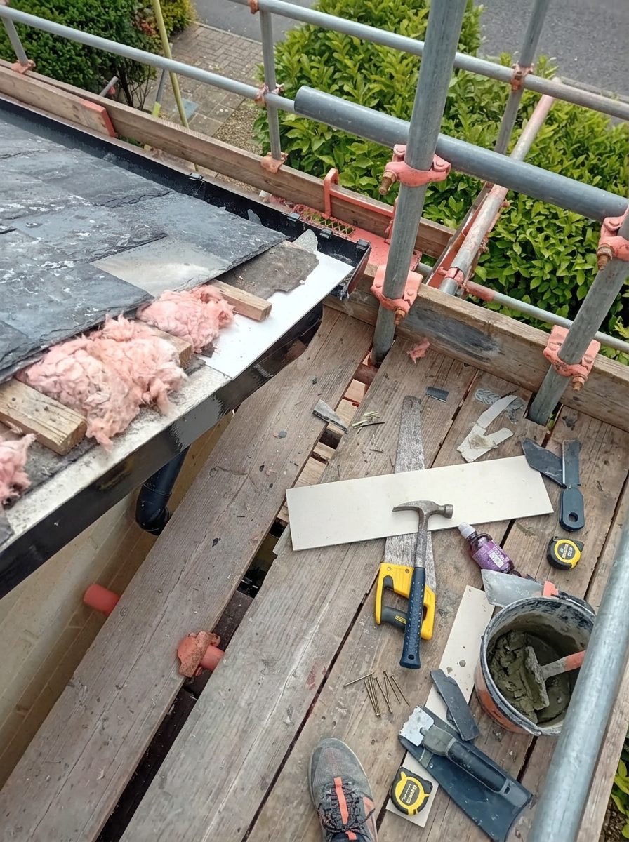 Old slate tiles stripped back to the rafters during a Bath re-roofing job